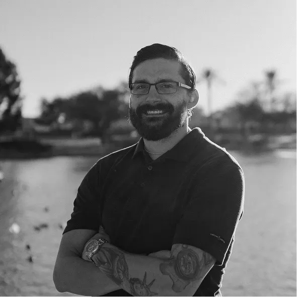 Aaron working on a laptop